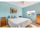 Light and bright bedroom with double bed and wooden furniture at 1064 N Tamiami Trl # 1311, Sarasota, FL 34236