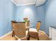 Small dining area with glass table and wicker chairs at 1064 N Tamiami Trl # 1311, Sarasota, FL 34236