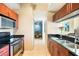 Modern kitchen with stainless steel appliances and granite countertops at 1064 N Tamiami Trl # 1311, Sarasota, FL 34236