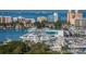 Stunning aerial view of a marina filled with yachts and boats at 1064 N Tamiami Trl # 1311, Sarasota, FL 34236