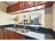 Kitchen features a breakfast bar overlooking the living room at 1064 N Tamiami Trl # 1311, Sarasota, FL 34236