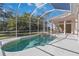 Refreshing screened pool and spa with open view at 1076 Mallard Marsh Dr, Osprey, FL 34229