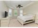 Bright bedroom with a queen-size bed, dresser and neutral decor at 11192 Whimbrel Ln, Sarasota, FL 34238