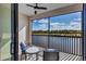 Relaxing screened balcony overlooking a lake and lush landscape at 16804 Vardon Ter # 403, Bradenton, FL 34211