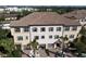 Three-story townhome community, featuring Spanish tile roofs and attached garages at 1904 Monte Carlo Dr, Sarasota, FL 34231