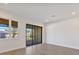 Spacious bedroom with hardwood floors and access to balcony at 1904 Monte Carlo Dr, Sarasota, FL 34231