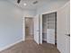 Bedroom with light blue walls, carpeted floor and closet at 1904 Monte Carlo Dr, Sarasota, FL 34231
