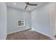 Bright bedroom with light blue walls and carpeted floor at 1904 Monte Carlo Dr, Sarasota, FL 34231