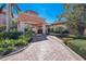 Attractive community entrance with landscaping and brick pavers at 1904 Monte Carlo Dr, Sarasota, FL 34231