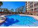 Relaxing kidney-shaped pool with ample deck space for sunbathing at 1904 Monte Carlo Dr, Sarasota, FL 34231