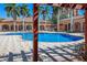 Resort-style pool with plenty of lounge chairs and shade structures at 1904 Monte Carlo Dr, Sarasota, FL 34231
