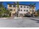 Three-unit townhome building with parking and tropical landscaping at 1904 Monte Carlo Dr, Sarasota, FL 34231