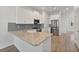 Modern kitchen with white shaker cabinets, granite counters, and stainless steel appliances at 1904 Monte Carlo Dr, Sarasota, FL 34231