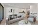 Open living room and kitchen with hardwood floors and modern furniture at 1904 Monte Carlo Dr, Sarasota, FL 34231