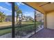 Private screened patio with backyard view, perfect for relaxing at 1904 Monte Carlo Dr, Sarasota, FL 34231