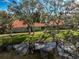 Aerial view of waterfront property with lush landscaping at 256 51St Street E Cir, Palmetto, FL 34221