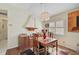 Dining room with wood floors, wood table and chairs, and model sailboat at 256 51St Street E Cir, Palmetto, FL 34221