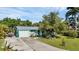Aerial view showing a teal home with a gray roof and a spacious yard at 312 San Marie Dr, Punta Gorda, FL 33950