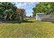 Large backyard with shed and lush landscaping at 312 San Marie Dr, Punta Gorda, FL 33950