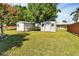 Spacious backyard with two storage sheds and grassy area at 312 San Marie Dr, Punta Gorda, FL 33950