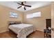 Bright bedroom with double bed, ceiling fan, and wood flooring at 312 San Marie Dr, Punta Gorda, FL 33950