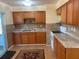 Functional kitchen with wood cabinets and granite countertops at 312 San Marie Dr, Punta Gorda, FL 33950