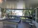 Screened lanai with pool table and backyard view at 312 San Marie Dr, Punta Gorda, FL 33950