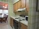 Well-equipped kitchen with wood cabinets and modern appliances at 4546 Longwater # 44, Sarasota, FL 34235