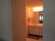 Bathroom with vanity, mirror, and white cabinetry at 4546 Longwater # 44, Sarasota, FL 34235