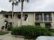 Condo building exterior with lush landscaping and parking at 4546 Longwater # 44, Sarasota, FL 34235