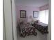 Bright bedroom with two twin beds, floral bedding, and two nightstands at 4546 Longwater # 44, Sarasota, FL 34235