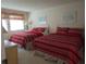 Two queen beds with red and white striped bedding at 4546 Longwater # 44, Sarasota, FL 34235