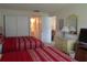Bedroom with two queen beds, dresser, and view of the bathroom at 4546 Longwater # 44, Sarasota, FL 34235