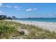Stunning beach view with white sand and clear water at 475 Benjamin Franklin Dr # 209, Sarasota, FL 34236
