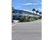 Modern building exterior with ample parking at 475 Benjamin Franklin Dr # 209, Sarasota, FL 34236