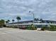 Building exterior showcasing mid-century modern architecture at 475 Benjamin Franklin Dr # 209, Sarasota, FL 34236