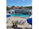 Relaxing pool area with ample lounge chairs and umbrellas at 475 Benjamin Franklin Dr # 209, Sarasota, FL 34236
