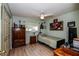 Cozy bedroom with a ceiling fan, closet, and vinyl floors at 4872 Limetree Ln, Venice, FL 34293