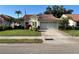 Charming single-story home with a tile roof, well-manicured lawn and two car garage at 4872 Limetree Ln, Venice, FL 34293