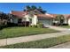 Charming single-story home featuring a well-manicured lawn and a two-car garage at 4872 Limetree Ln, Venice, FL 34293