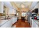 Bright kitchen featuring white cabinets, stainless steel appliances, and a breakfast nook at 4872 Limetree Ln, Venice, FL 34293