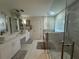 Large bathroom boasting double sinks, a shower, and a bathtub at 5211 Moon Shell Dr, Apollo Beach, FL 33572