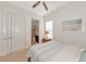 Bright bedroom with double doors, window, and comfortable bedding at 5238 Napoli Run, Bradenton, FL 34211