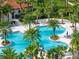 Aerial view of resort-style pool with palm trees and lounge chairs at 5732 Tripoli Dr, Palmetto, FL 34221