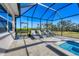 Relaxing pool and spa area with covered patio and lounge chairs at 5818 Tidewater Preserve Blvd, Bradenton, FL 34208