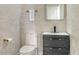 Modern powder room with floating vanity and dark wood at 62 Audubon Pl, Sarasota, FL 34237