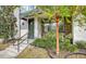 Modern townhome front entrance with steps and landscaping at 62 Audubon Pl, Sarasota, FL 34237