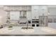 Contemporary kitchen featuring white and wood cabinets at 62 Audubon Pl, Sarasota, FL 34237