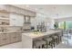 Open concept kitchen with island and breakfast bar at 62 Audubon Pl, Sarasota, FL 34237