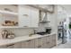 Sleek kitchen with wood cabinets and quartz countertops at 62 Audubon Pl, Sarasota, FL 34237
